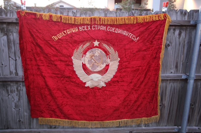 Soviet red velvet flag with pale USSR state emblem, 'Proletarii Vsekh Stran Soedinyaytes'
