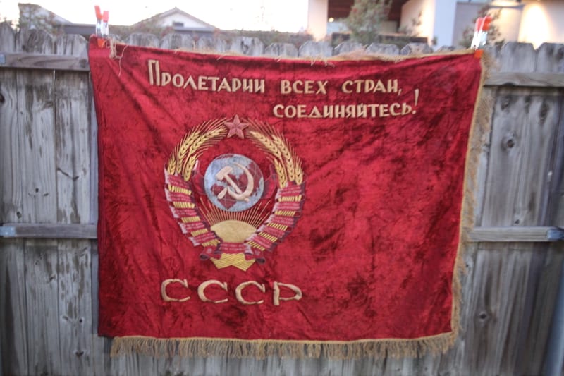 Soviet red velvet flag with USSR state emblem and 'SSSR' inscription