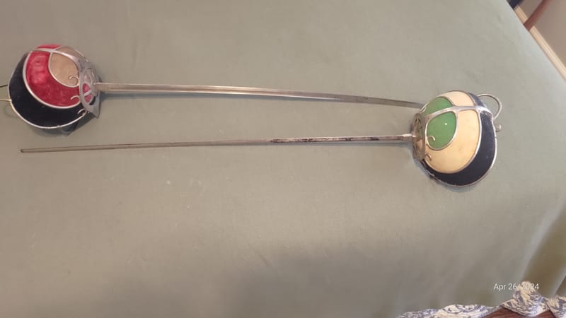 Swept-hilt rapier with green and cream guard